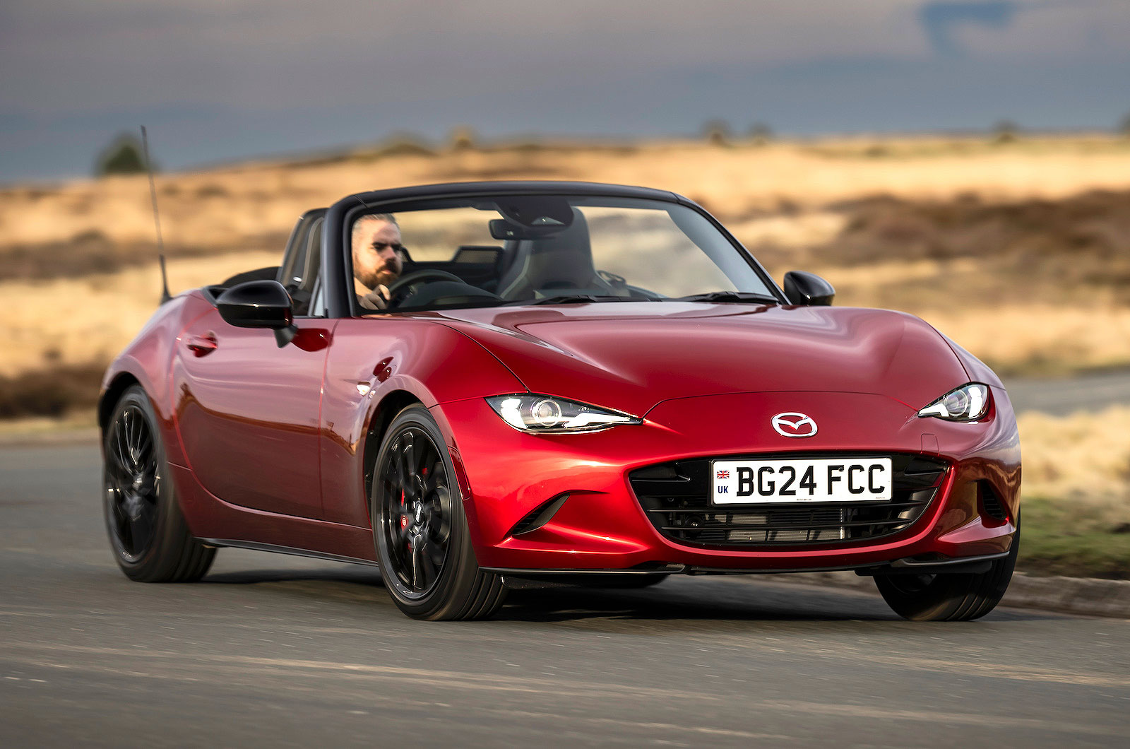 Red Mazda MX-5 Roadster front cornering