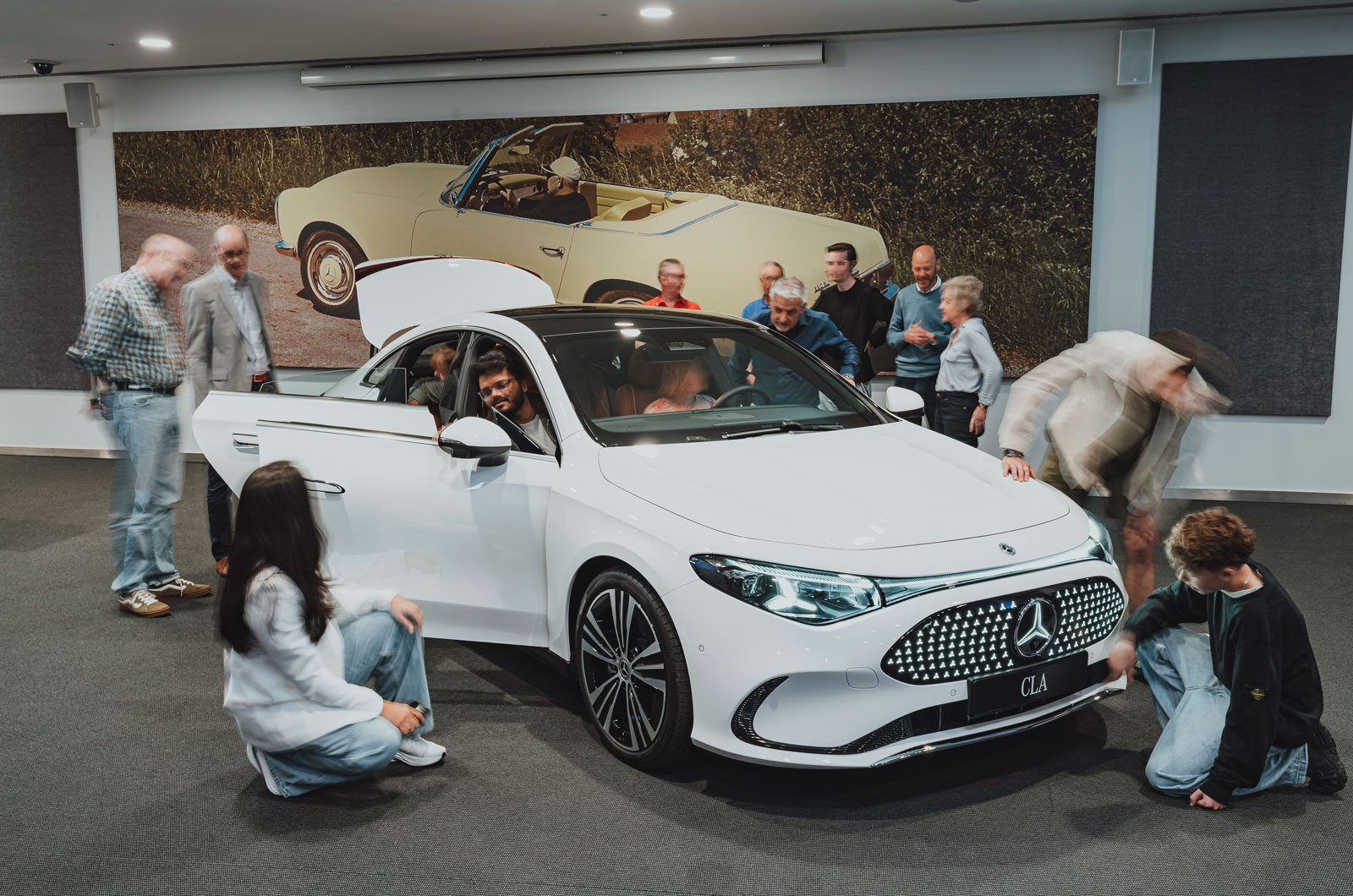 Mercedes-CLA-reader-test-team-readers-looking-at-car