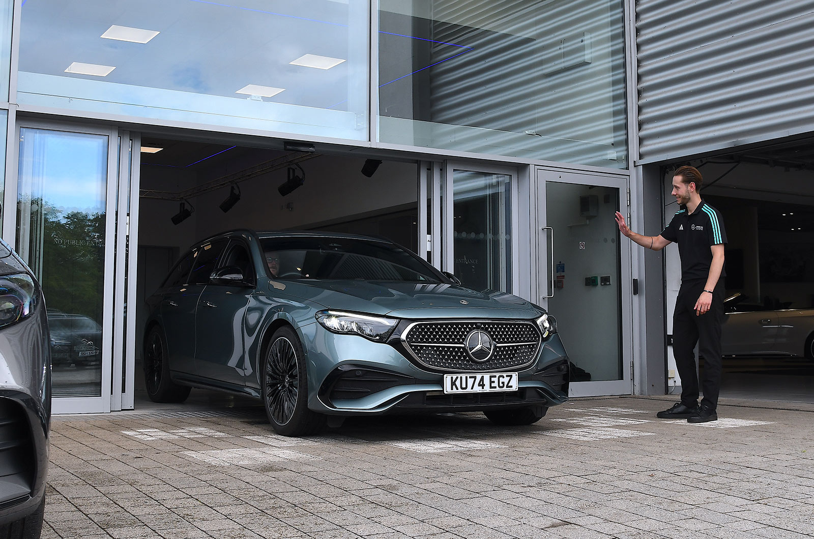 Mercedes E300de Estate front driving dealer handover