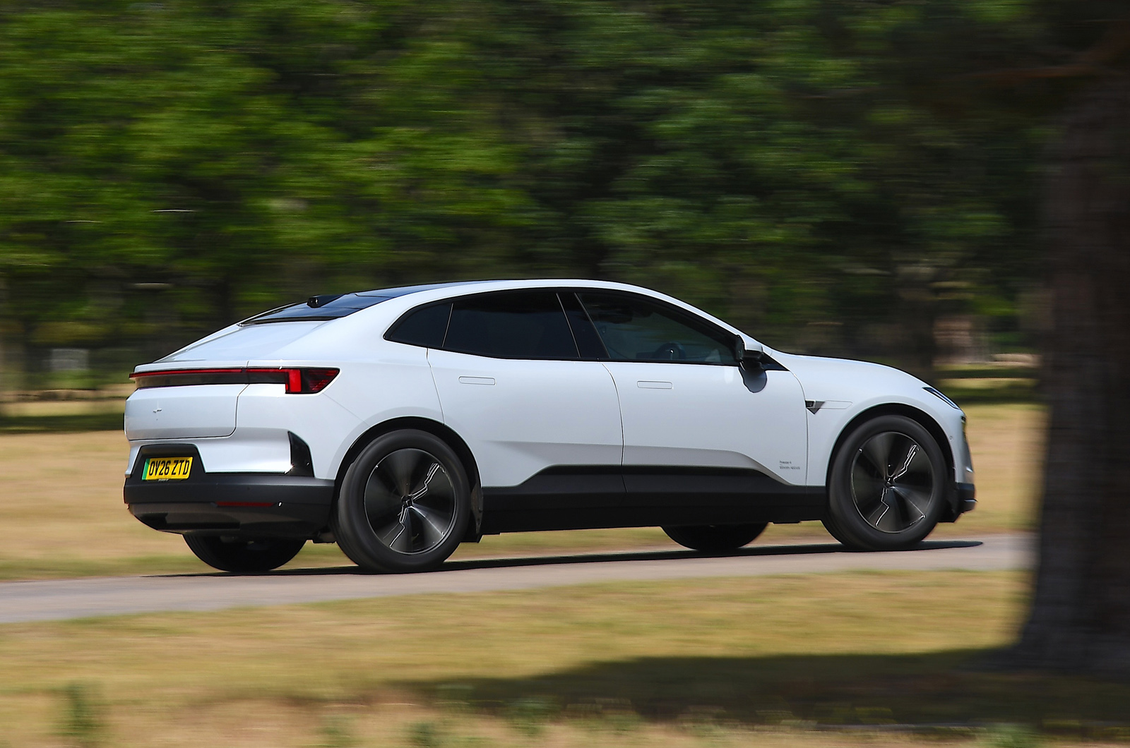 Polestar 4 LT rear driving in countryside