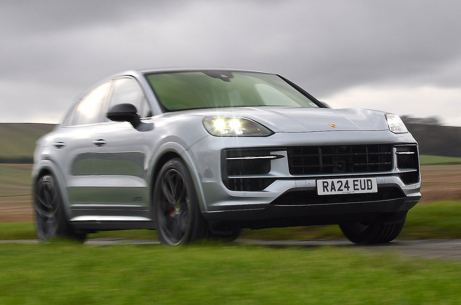 porsche-cayenne-coupe-front-right-driving-main