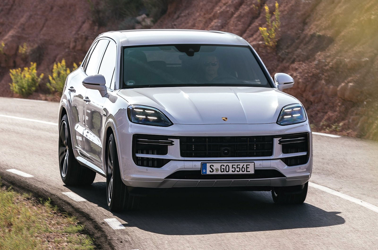 White Porsche Cayenne front cornering