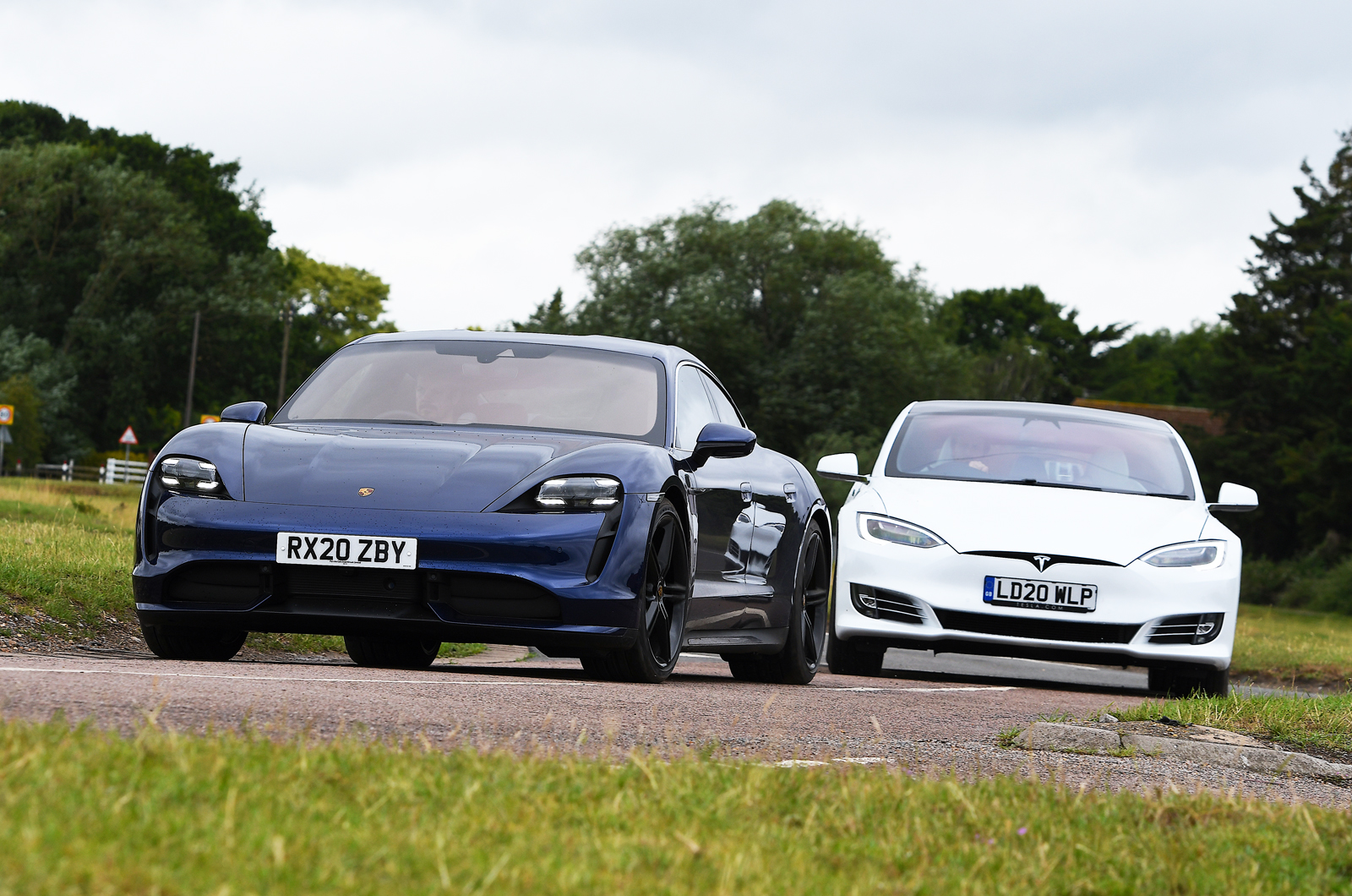 Porsche Taycan and Tesla Model S front cornering