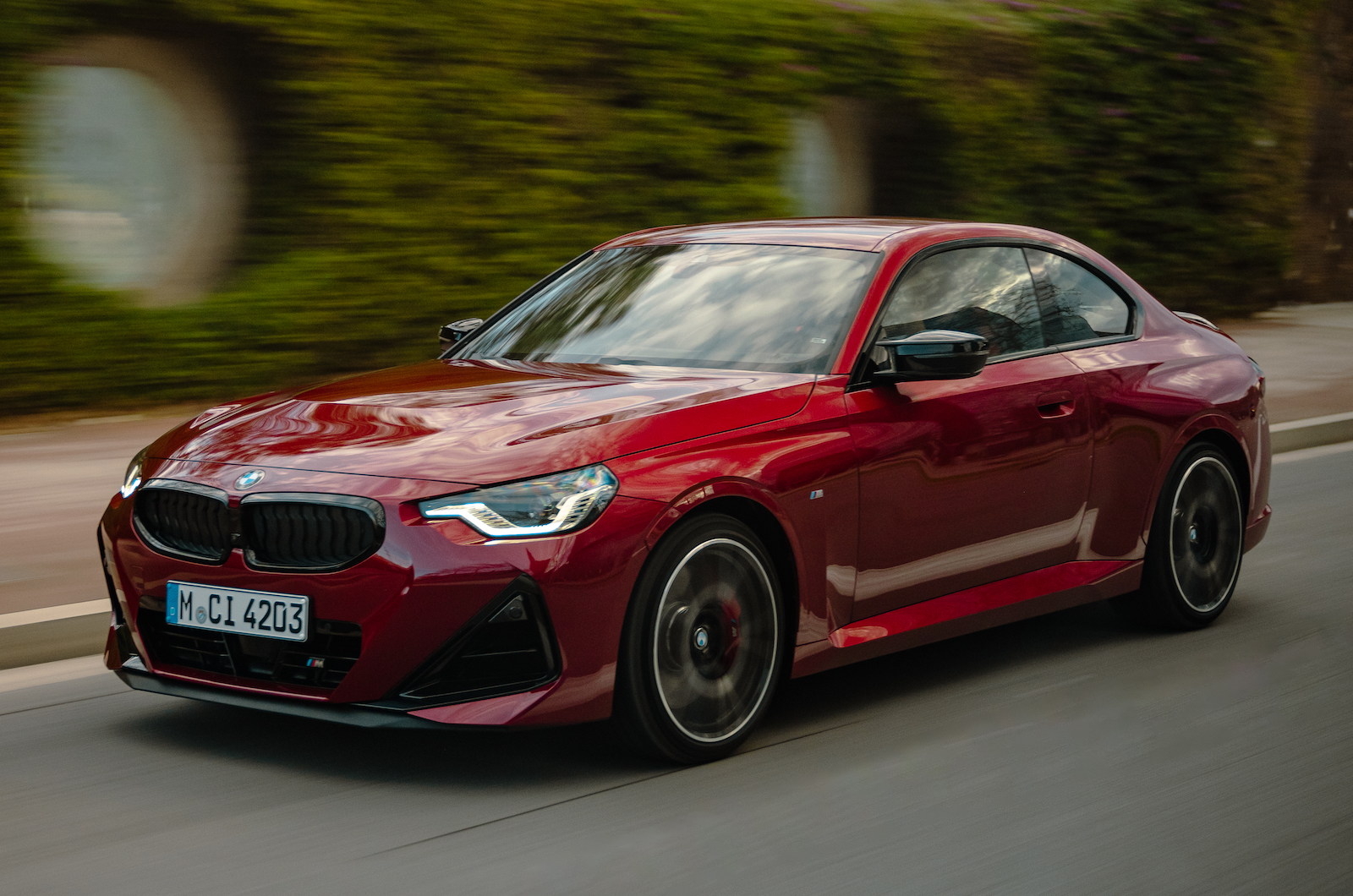 Red BMW 2 Series front left driving