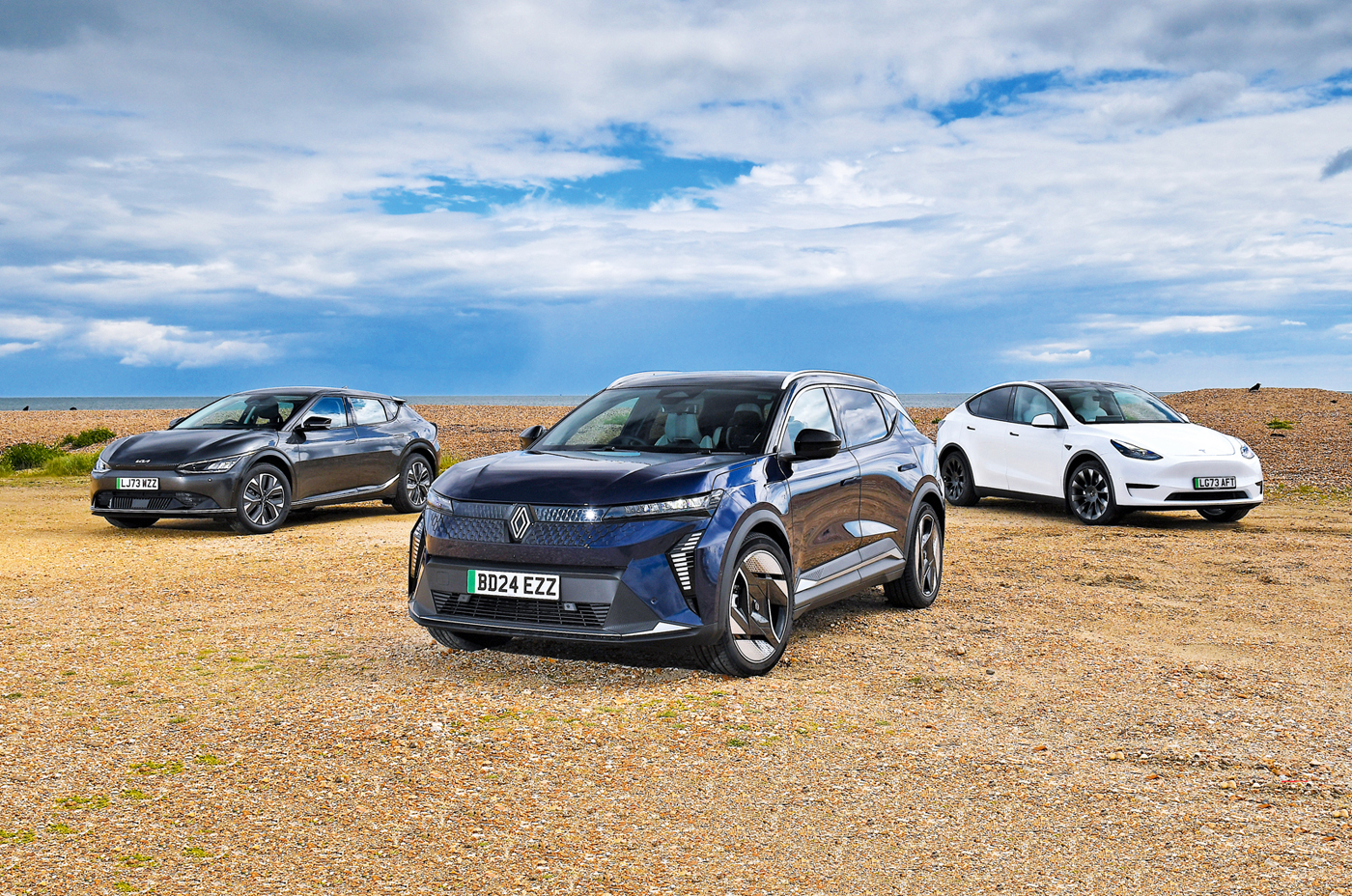 Renault Scenic vs Kia EV6 vs Tesla Model Y fronts from low down