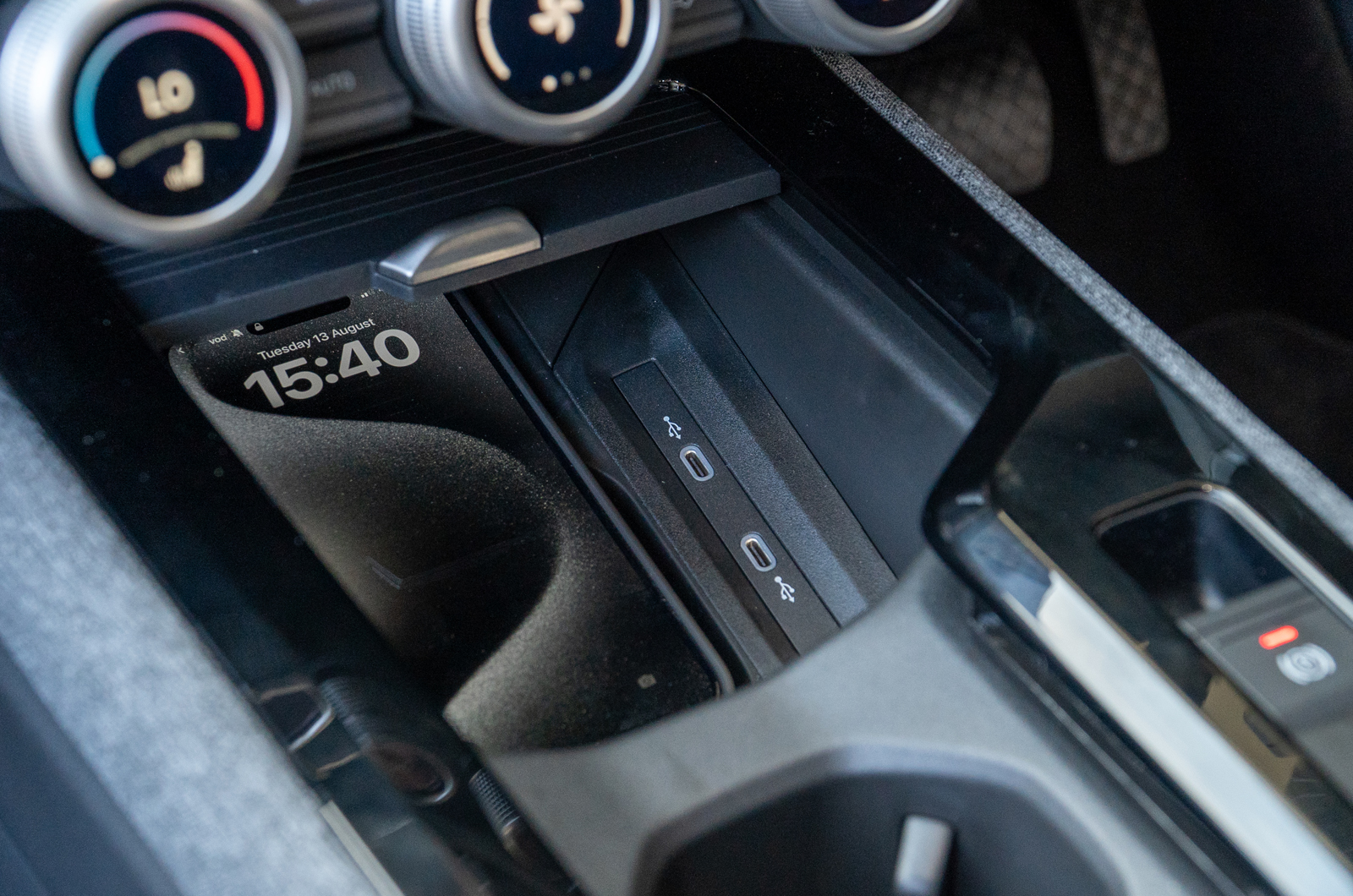 Skoda Superb interior close-up of the wireless phone charger and USB C ports