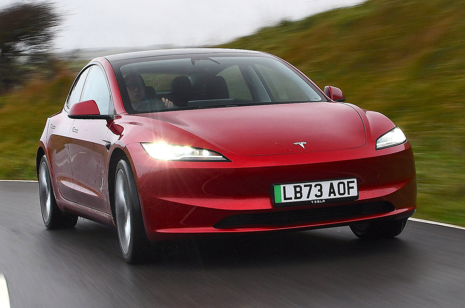 Tesla Model 3 front right driving