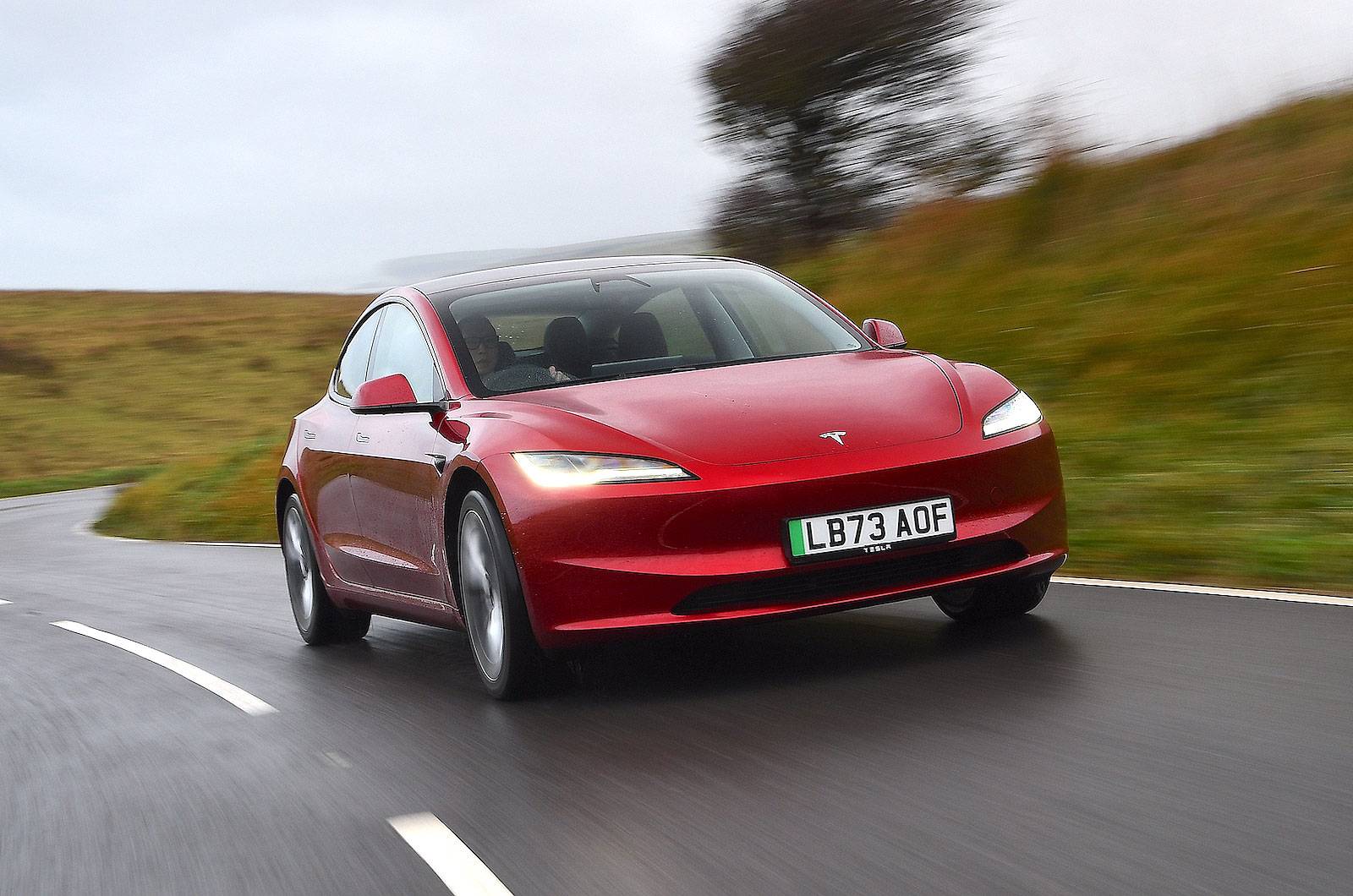 Tesla Model 3 front right driving