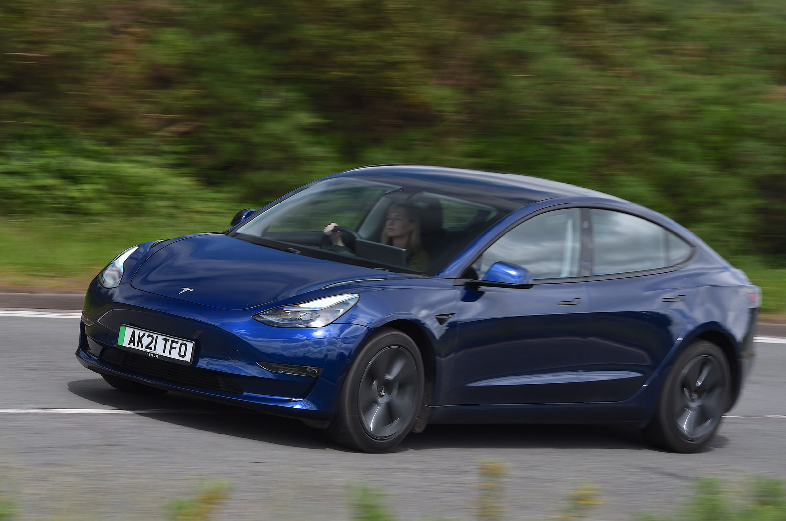 Tesla Model 3 used blue 2021 Claire driving car