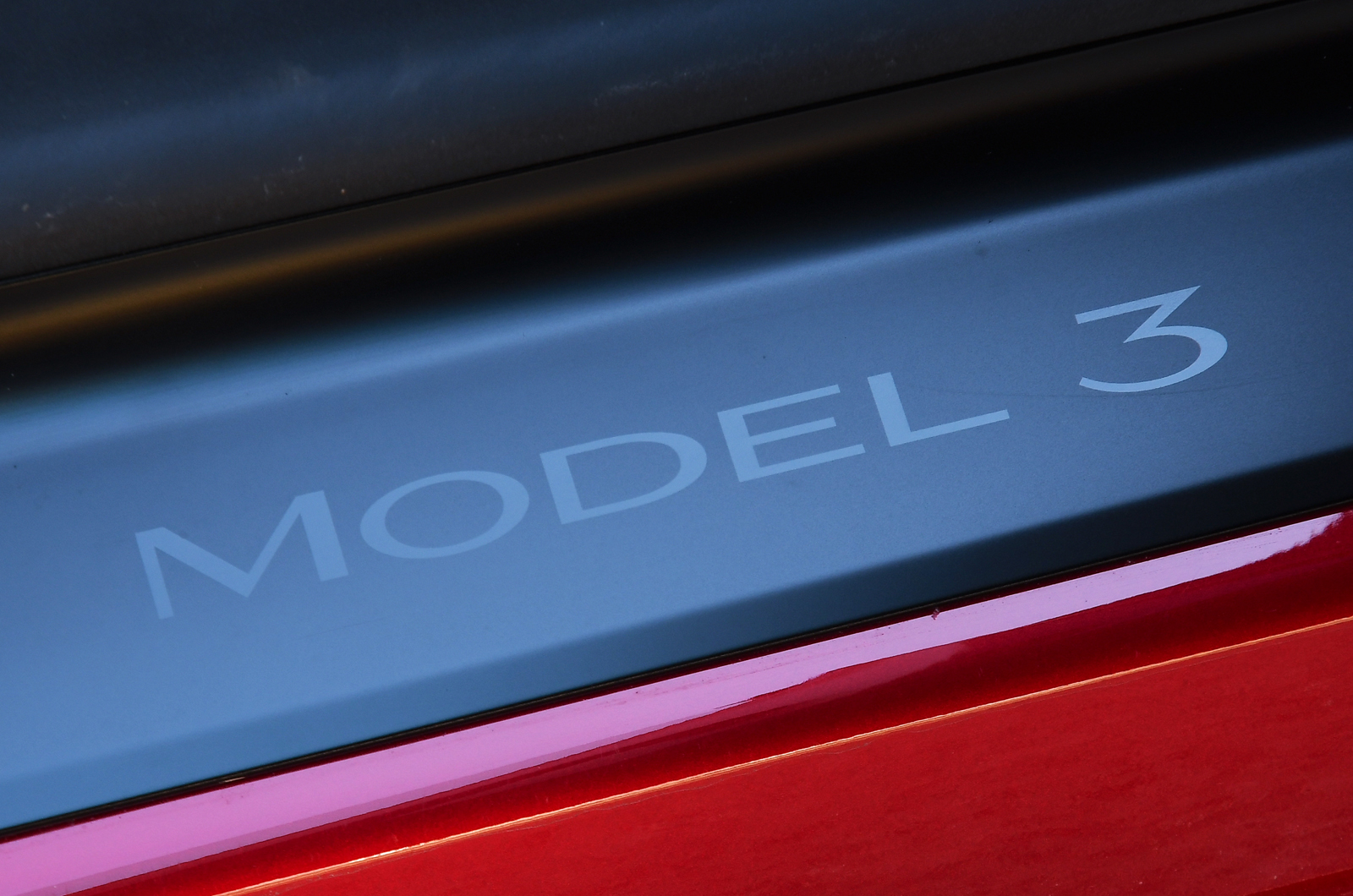 Tesla Model 3 door sill badge