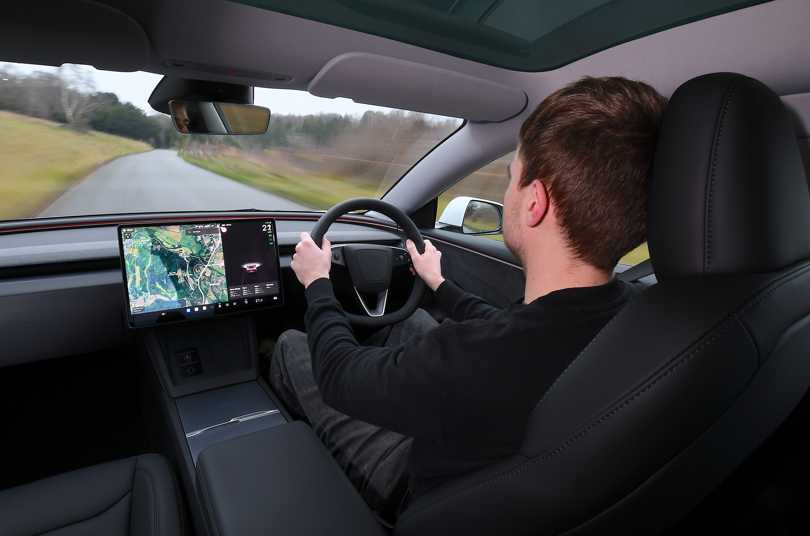 Tesla Model 3 dashboard driving