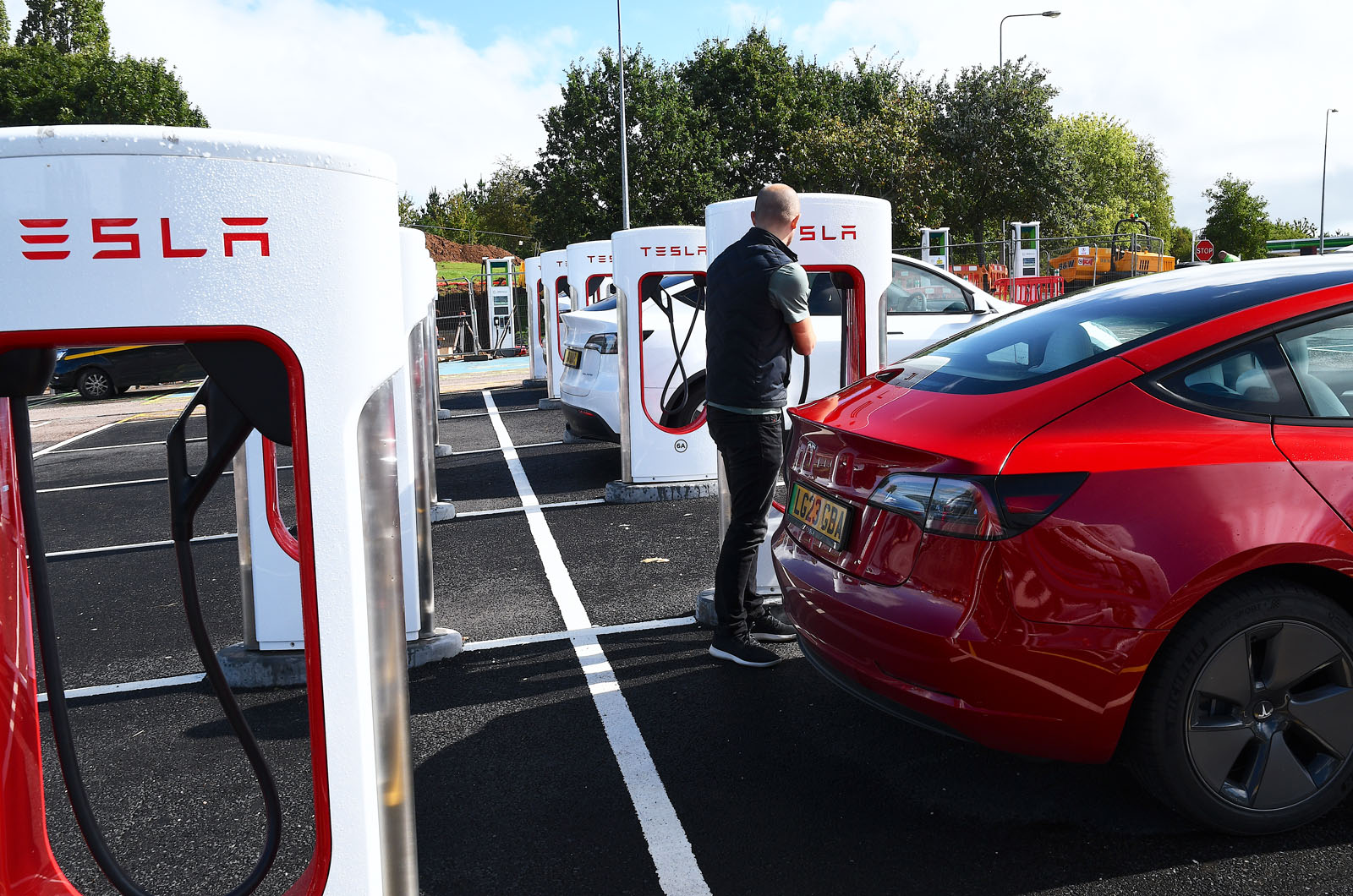 Tesla Model 3 plugged in to Supercharger