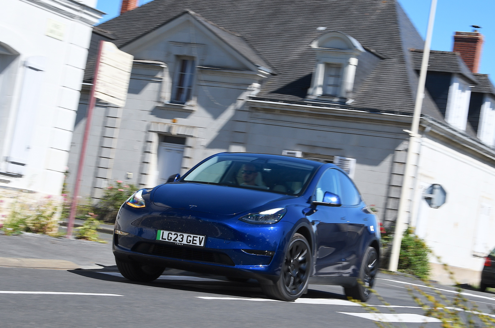 Tesla Model Y driving through town