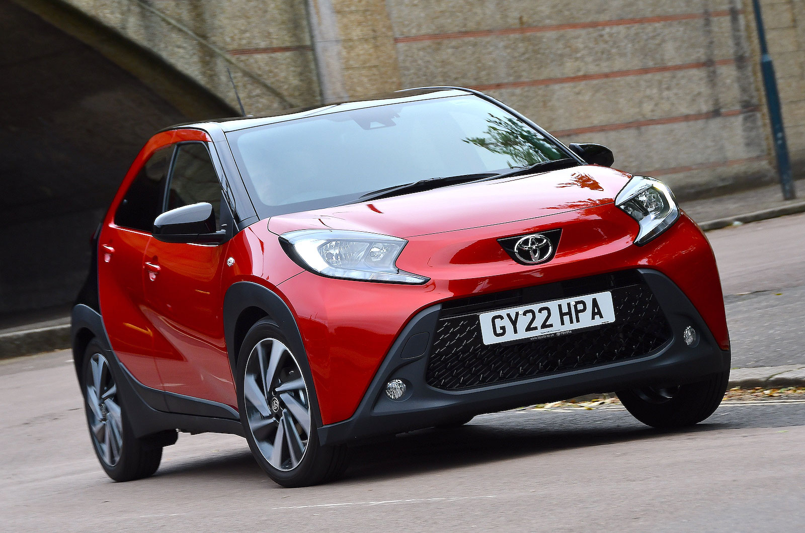 Red Toyota Aygo X front cornering