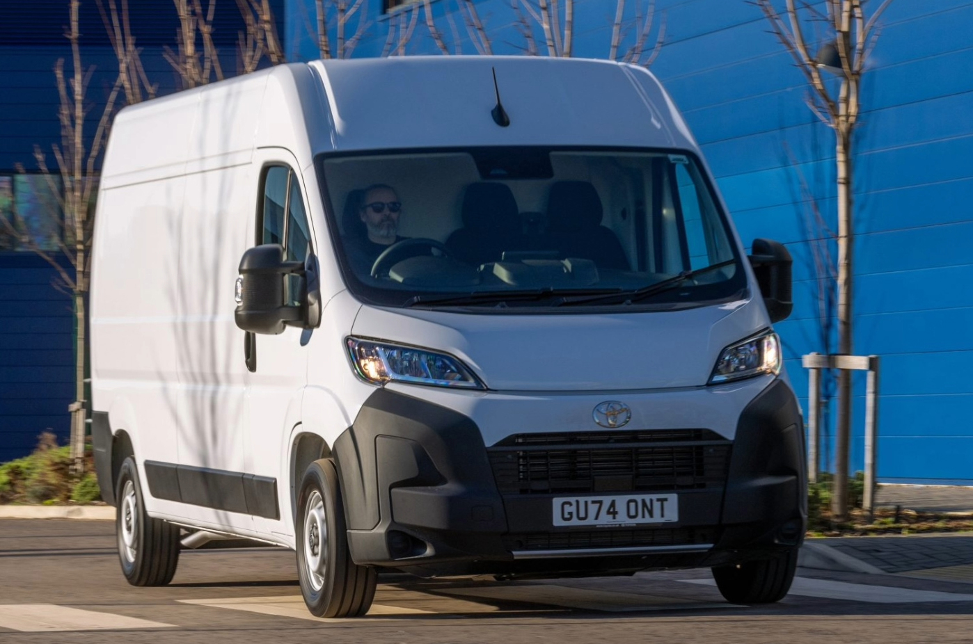 Toyota Proace Max driving front quarter shadow