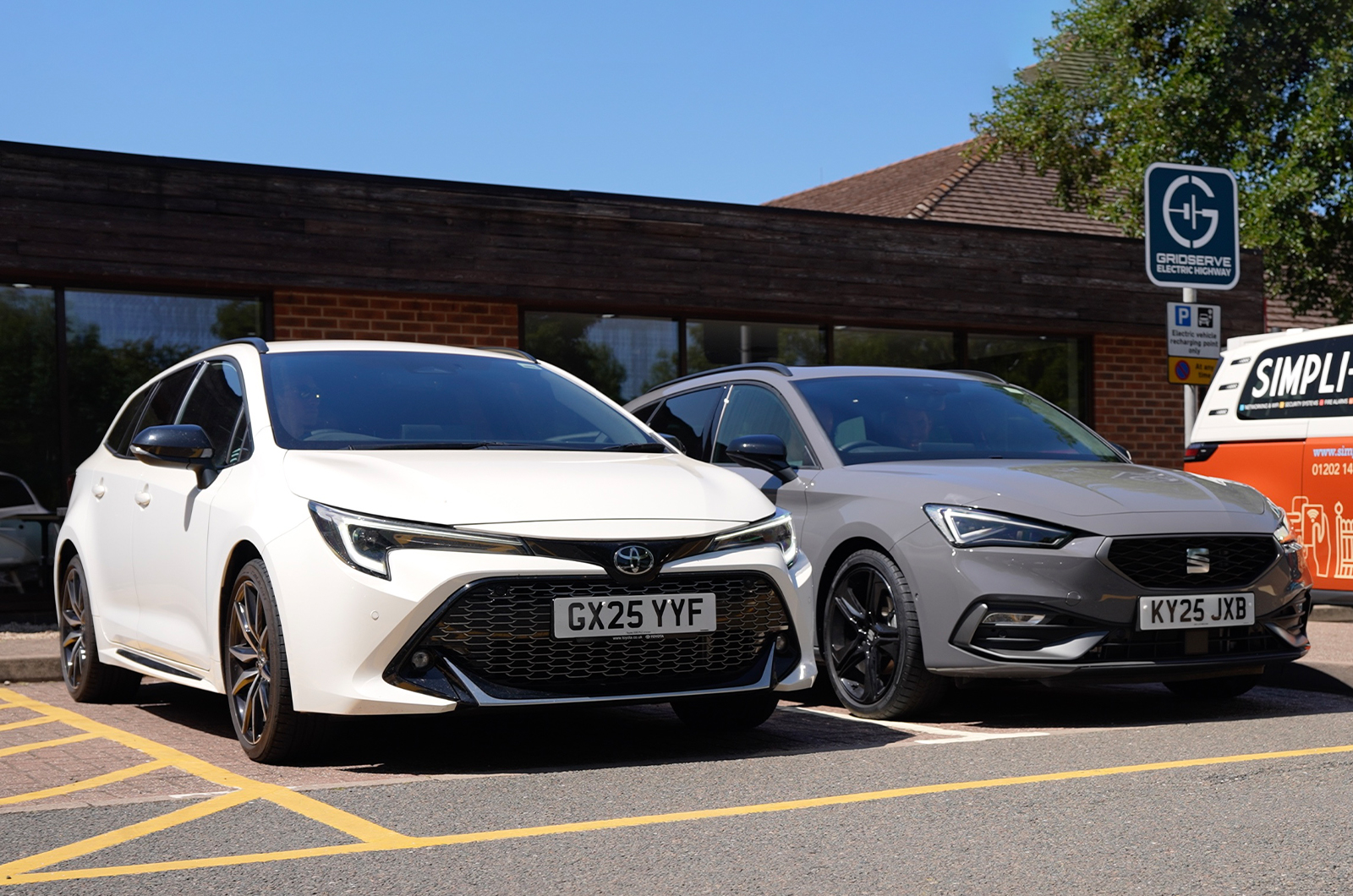Toyota Corolla Touring Sports parked next to Seat Leon Estate