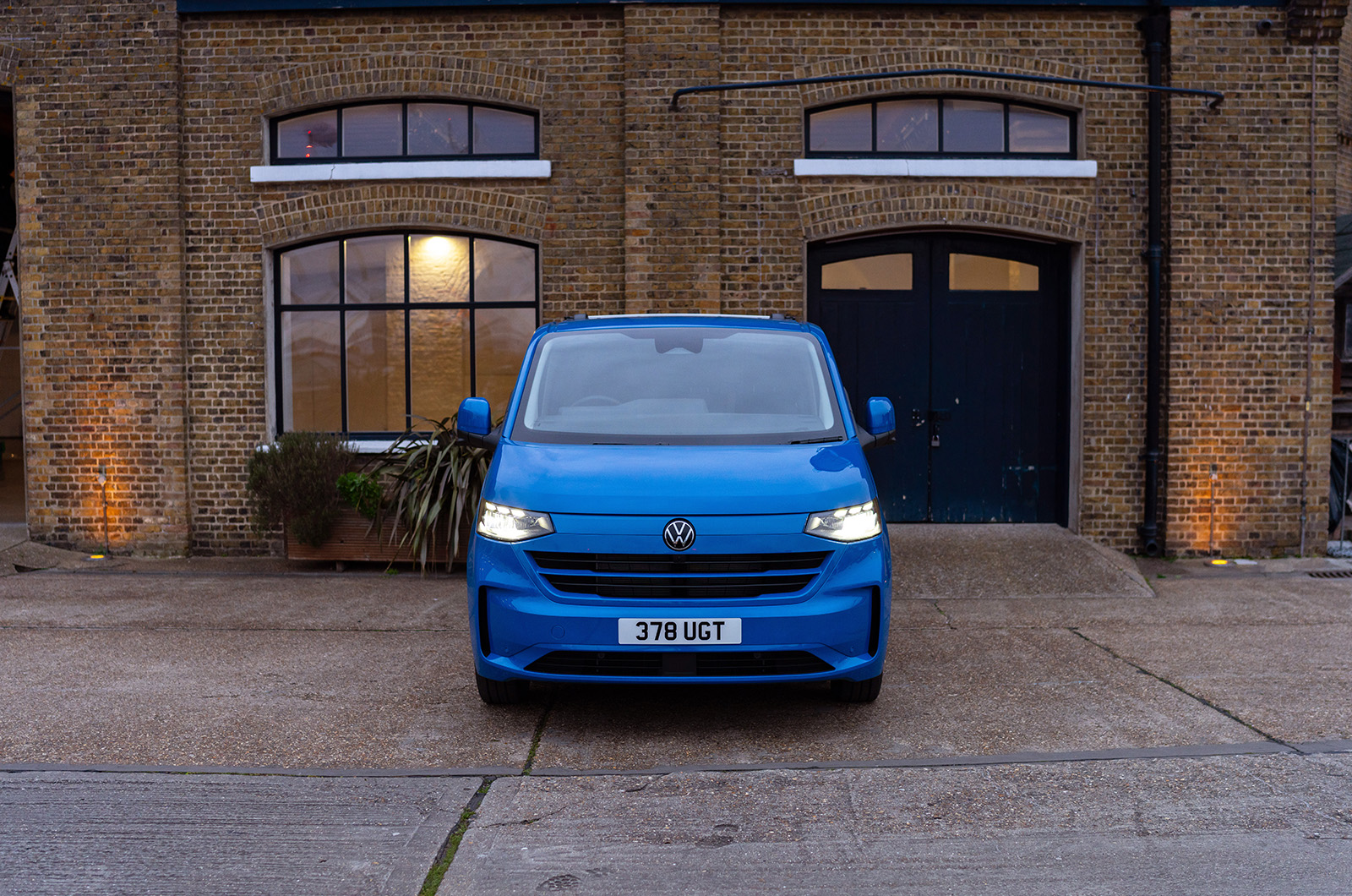 Blue Volkswagen Transporter front-on
