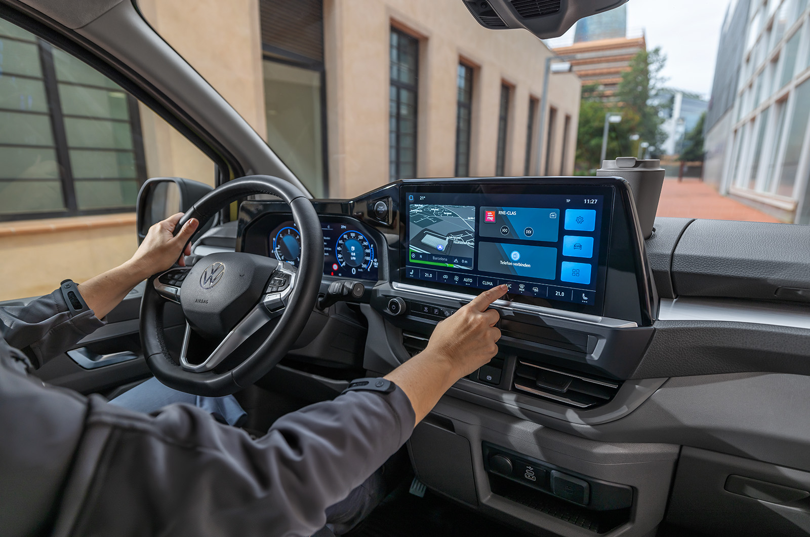 Interior of a Vokswagen Transporter van showing the infotainment screen and dash area