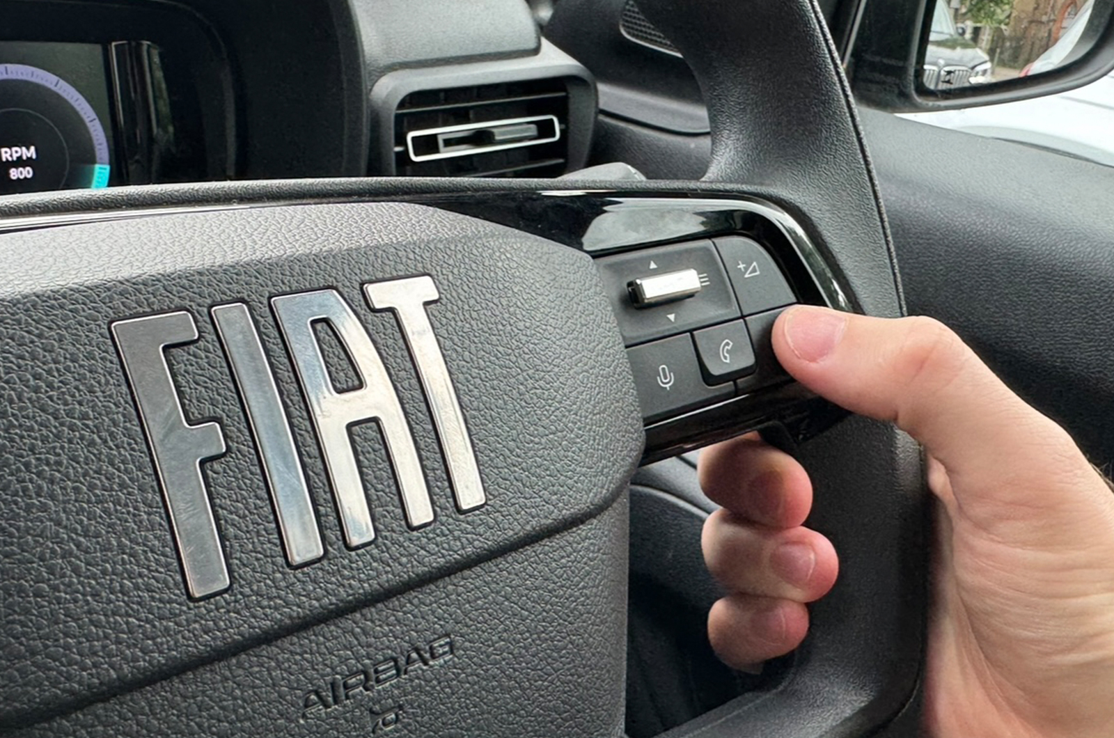 Tom Goodban demonstrating the voice command control in the Fiat Doblo