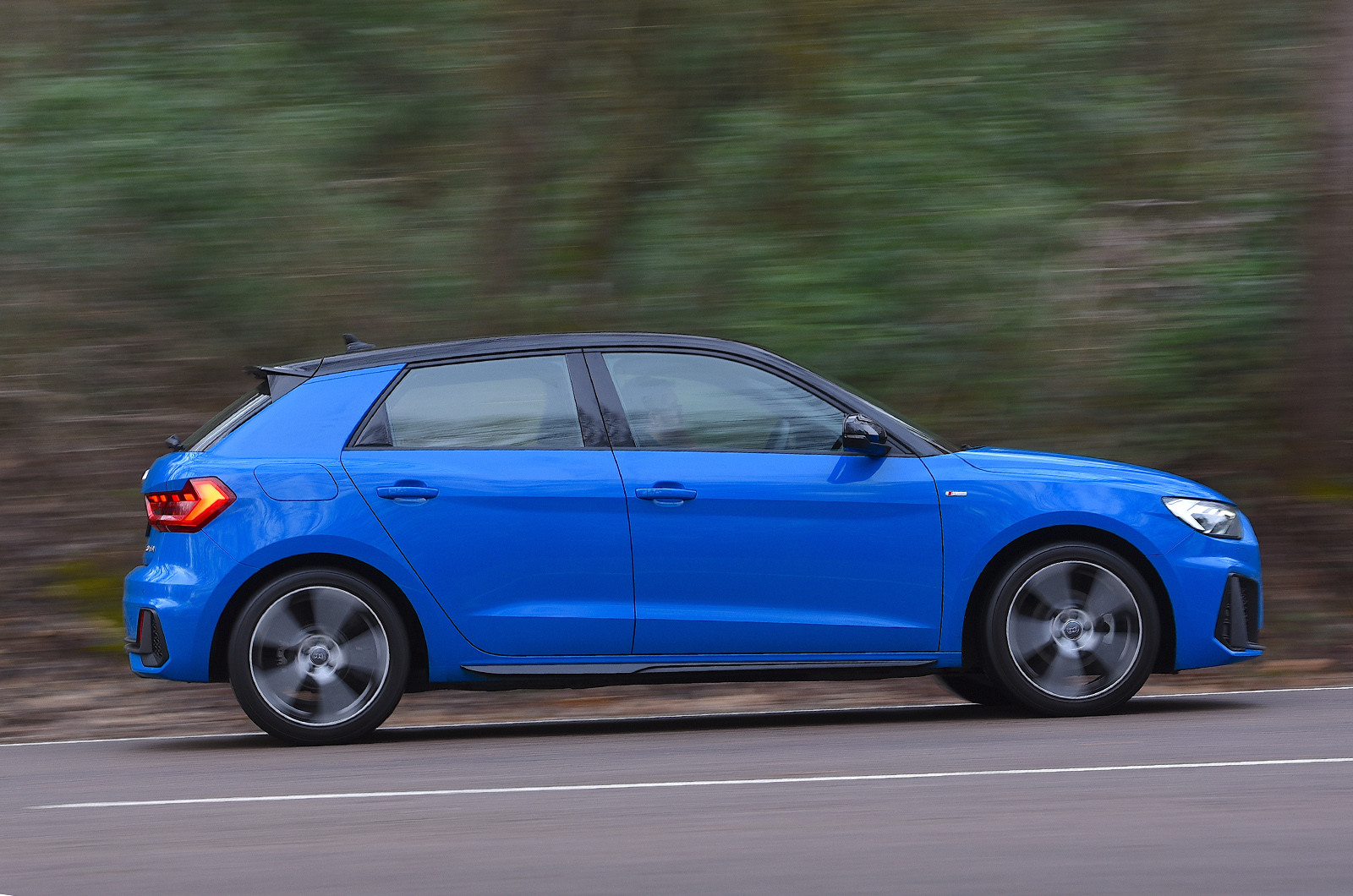 Used Audi A1 2018-present side driving blue