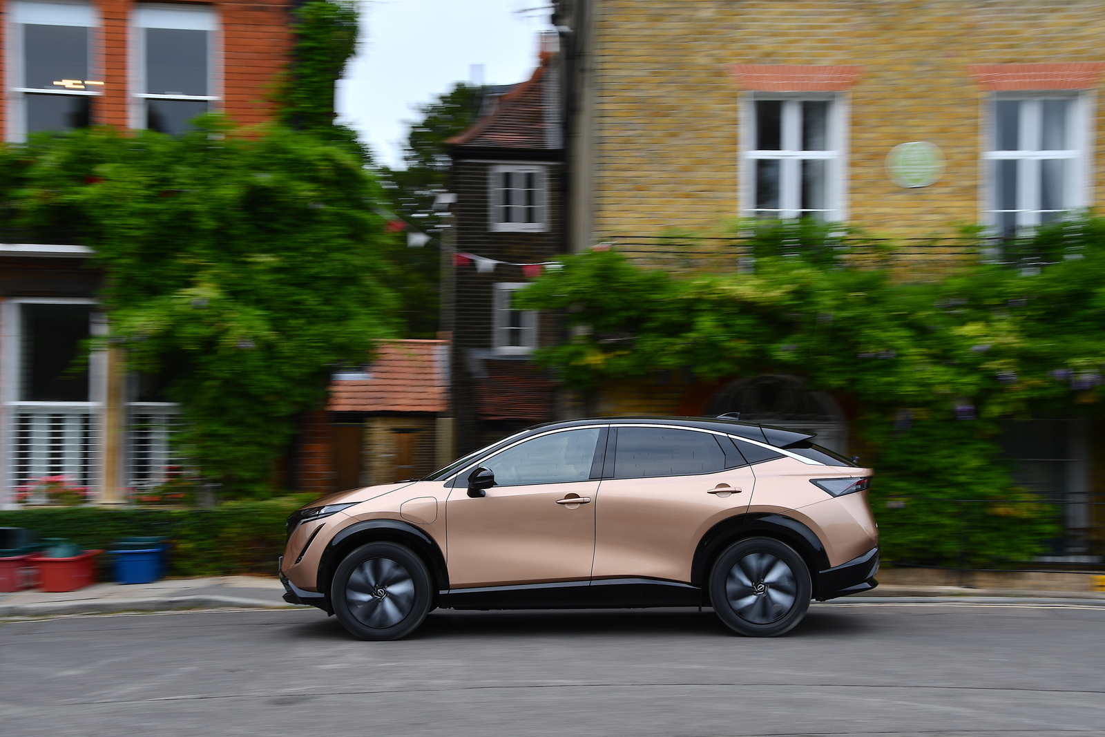 Used Nissan Ariya 2022-present side driving copper