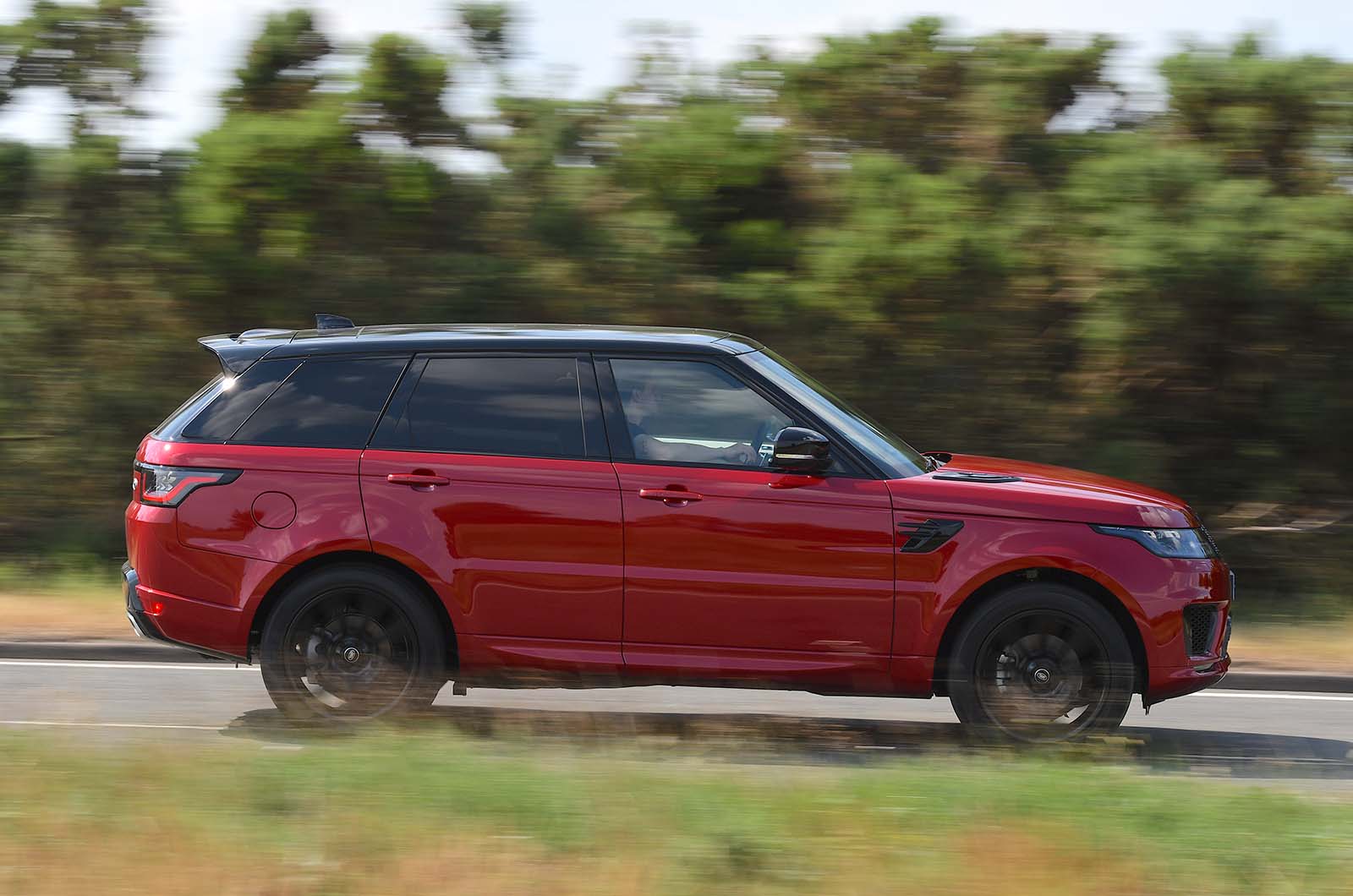 Used Range Rover Sport 2013-2022 side driving red