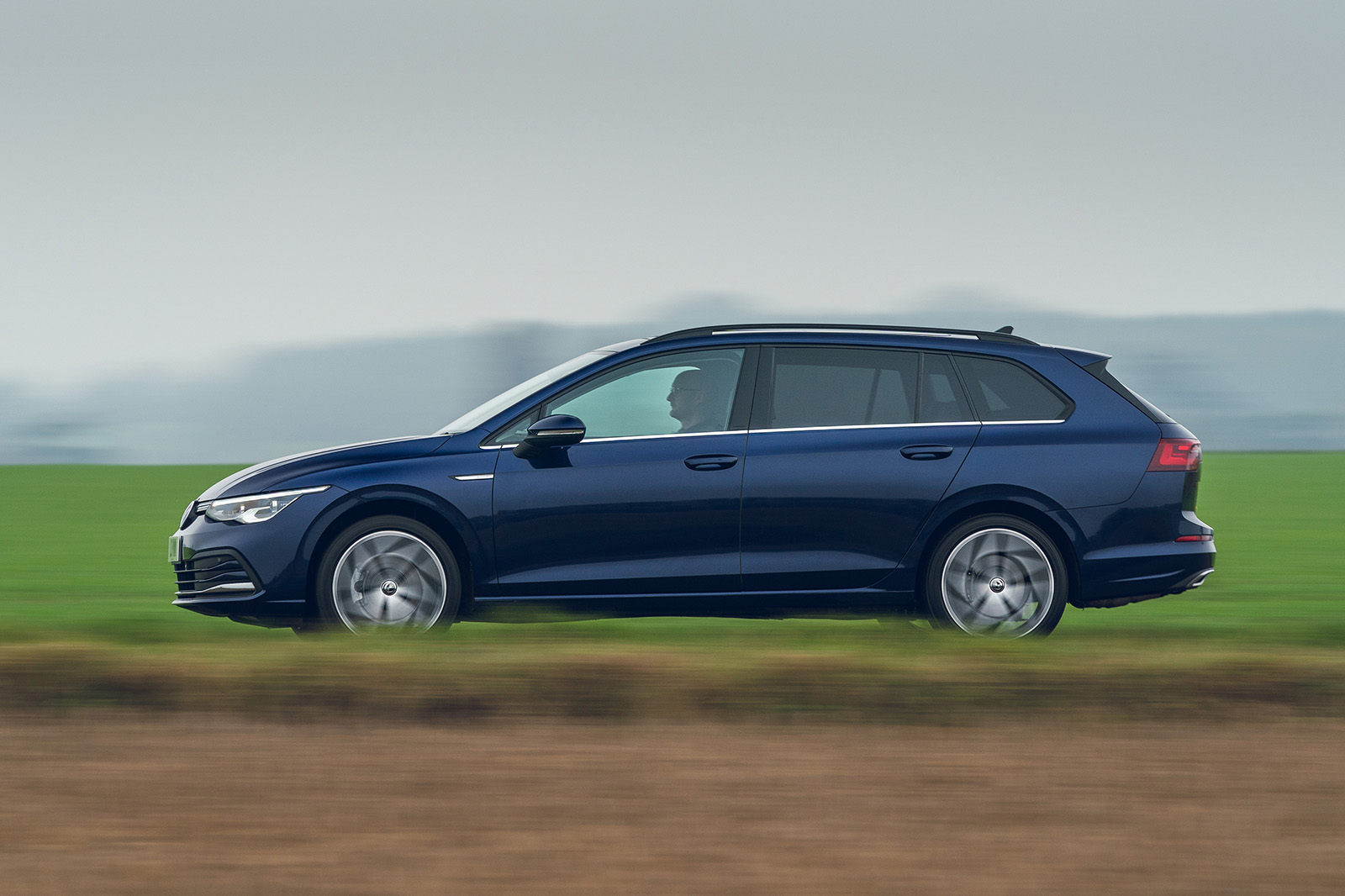 Used Volkswagen Golf Estate 2020-present side driving blue