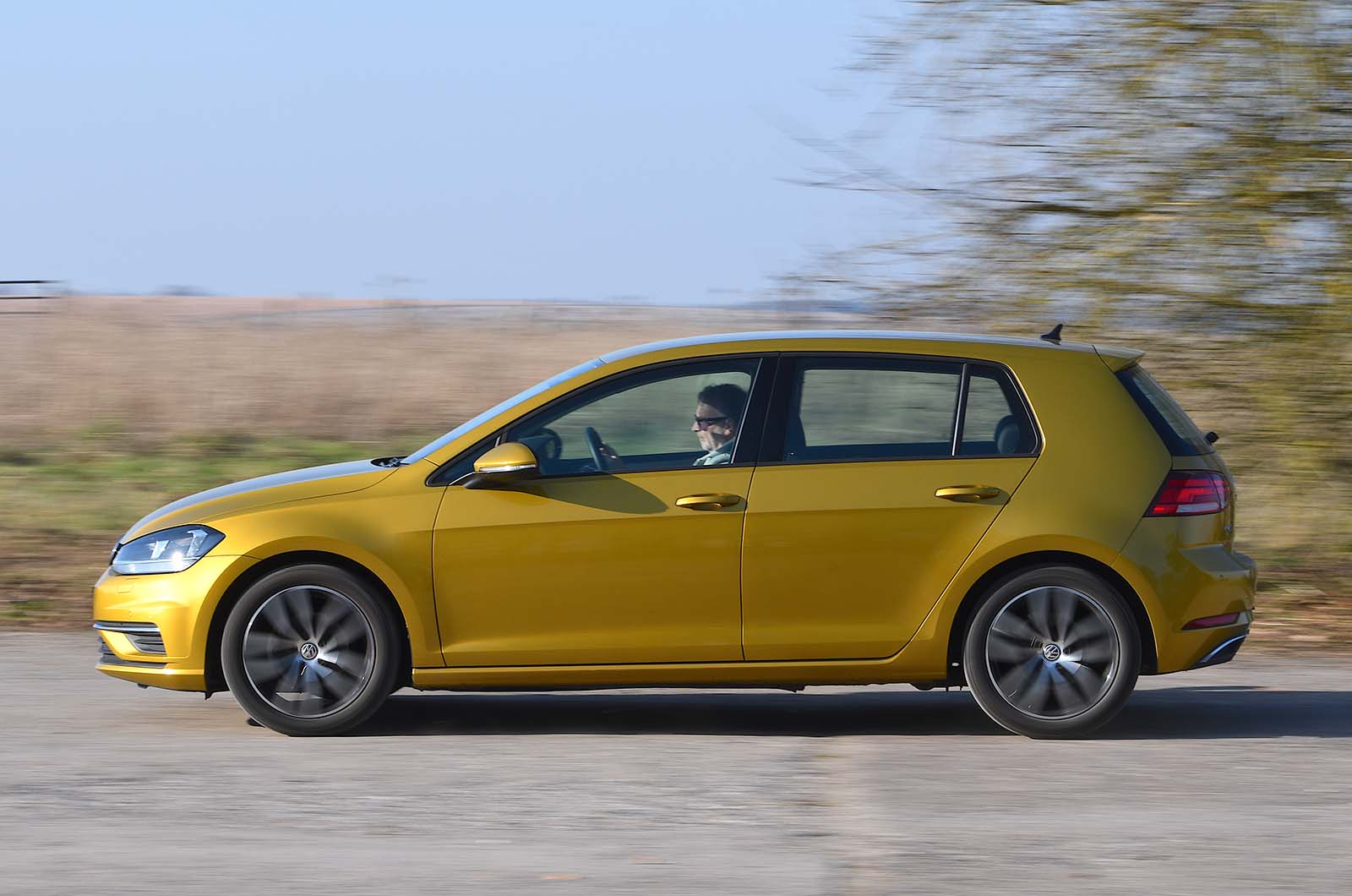 Used Volkswagen Golf 2013-2020 side driving yellow