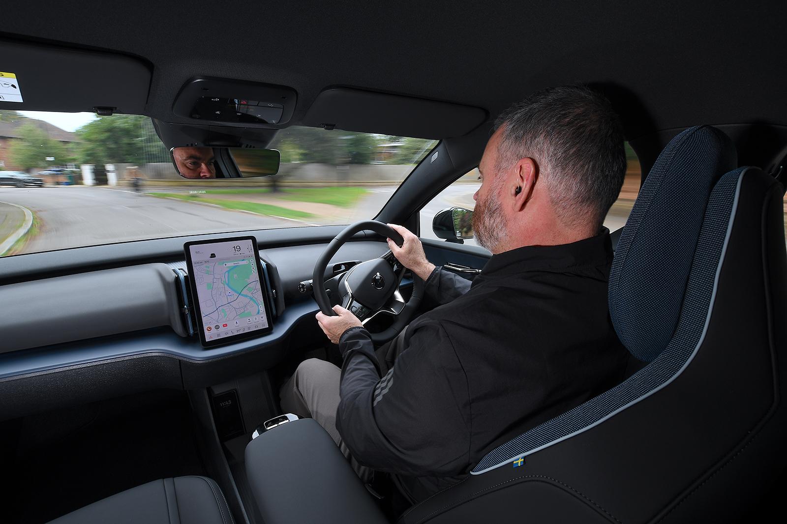 Volvo EX30 over shoulder driving