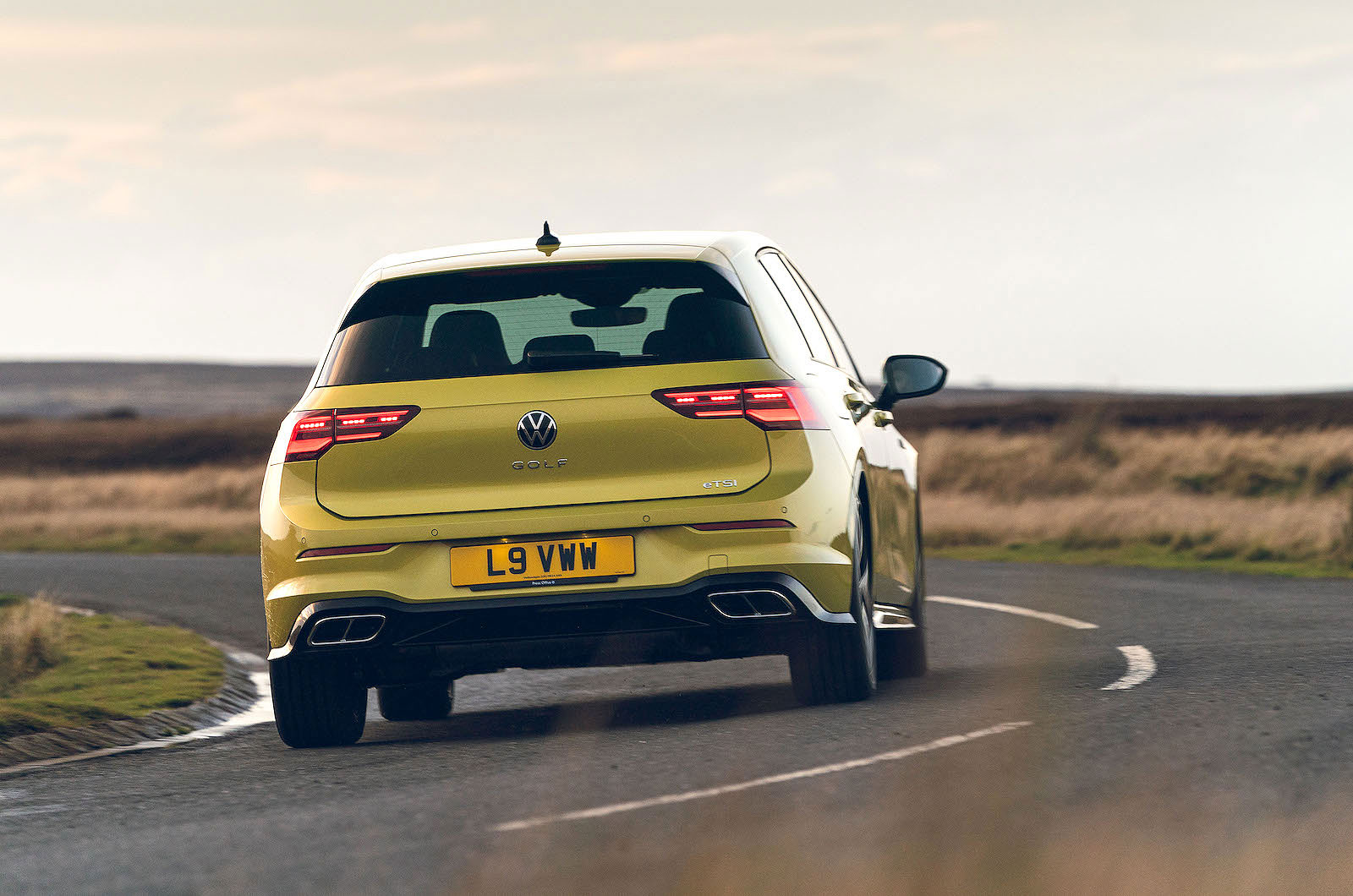 Yellow VW Golf rear cornering