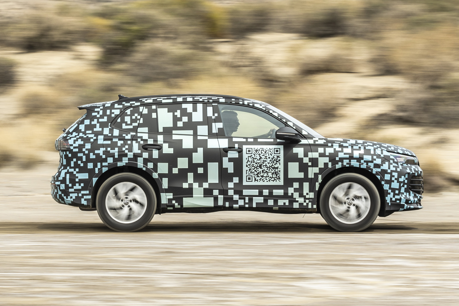 VW Tiguan camo drive driving side 2024