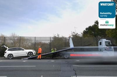 Broken down car being loaded onto a trailer