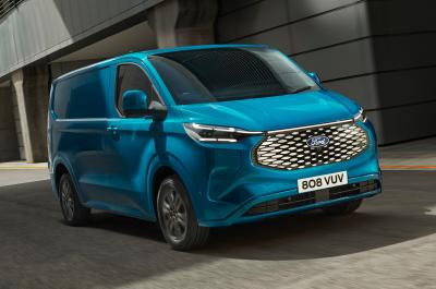 2023 Ford E-Transit Custom in light blue, driving