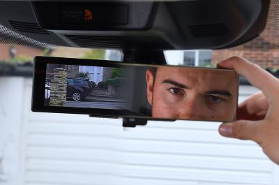 The X-Trail's rear-view mirror doubles as a screen