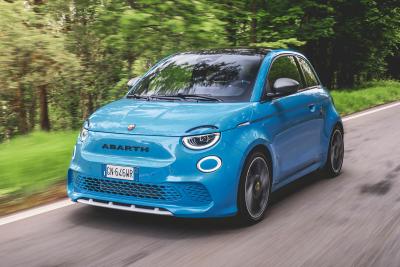 Abarth 500e driving front 3q 2023