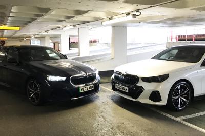 BMW i5 LT with BMW 520i in car park