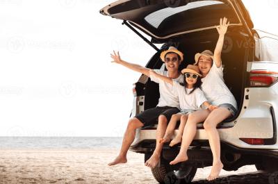 car hire family in boot waving
