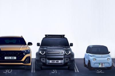Large and small cars in car park spaces