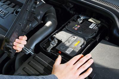 Car battery being checked