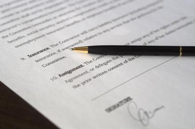 Close up of a pen on car insurance form