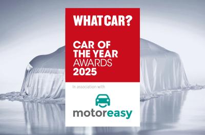 Car under sheet and COTY 2025 logo