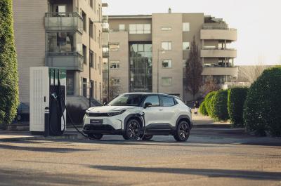 White Toyota Urban Cruiser charging in the city