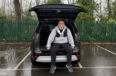 Darren sitting on Land Rover Discovery tailgate