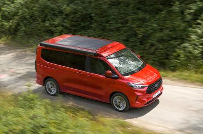 Red Ford Transit Custom Nugget with solar panels