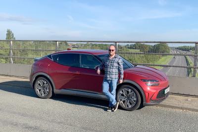 Genesis GV60 side on motorway bridge