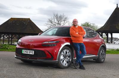 Genesis GV60 LT with Stuart Milne standing in front of it