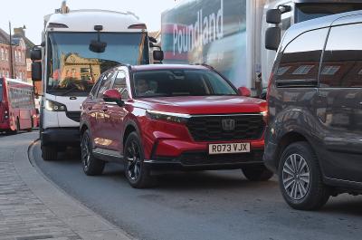 Honda CR-V hybrid city driving, front 2023