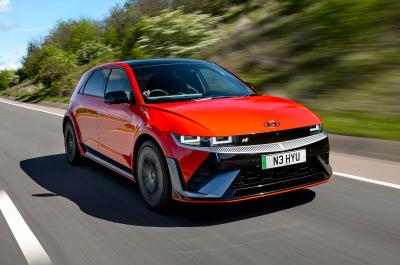 Orange Hyundai Ioniq 5 N front right driving