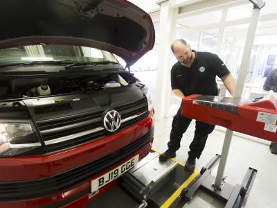 Inside Marshall’s Reading Van Centre, the reception desks back onto a bright white vehicle inspection bay with a raft of high-tech diagnostic equipment