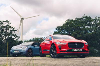 Jaguar I-Pace and Volkswagen ID.3 in front of wind turbine